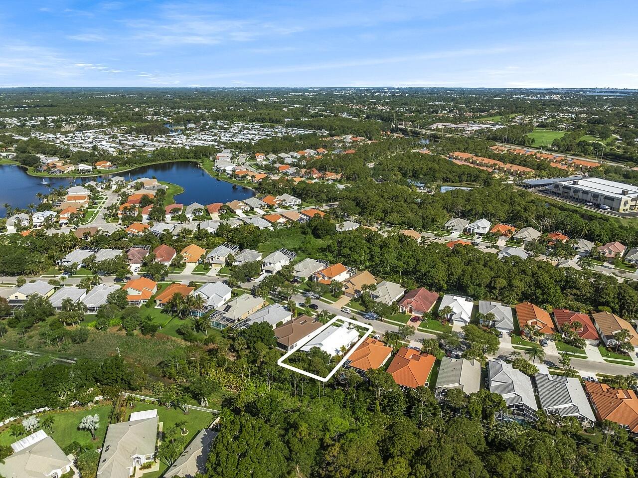 7313 Southeast Seagate Lane Stuart, FL 34997 - Photo 39 of 50 an aerial view of residential houses with outdoor space and trees