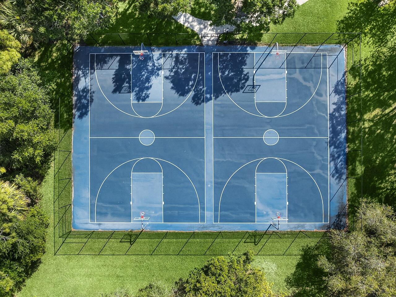 7313 Southeast Seagate Lane Stuart, FL 34997 - Photo 49 of 50 a wooden fence with some plants in the background