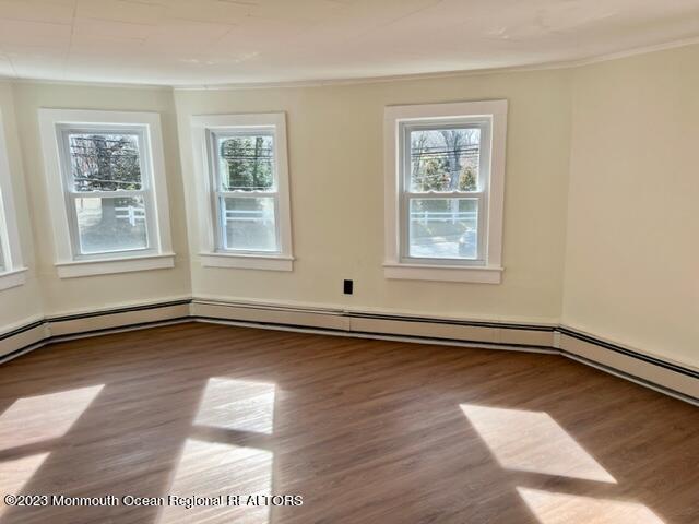 148 B West Sylvania Avenue, Unit B Neptune City, NJ 07753 - Photo 4 of 6 a view of a room with wooden floors and windows