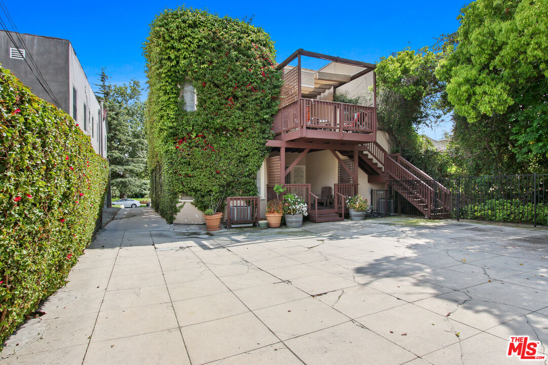 617 North Plymouth Boulevard, Unit 617 1/2 Los Angeles, CA 90004 - Photo 19 of 20 a view of a street with potted plants