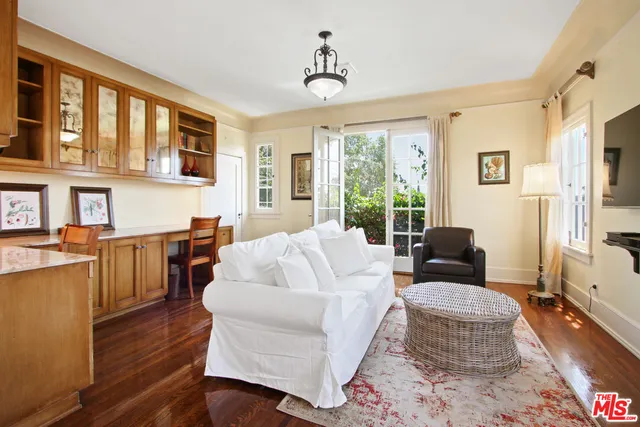 a living room with fireplace furniture and a window