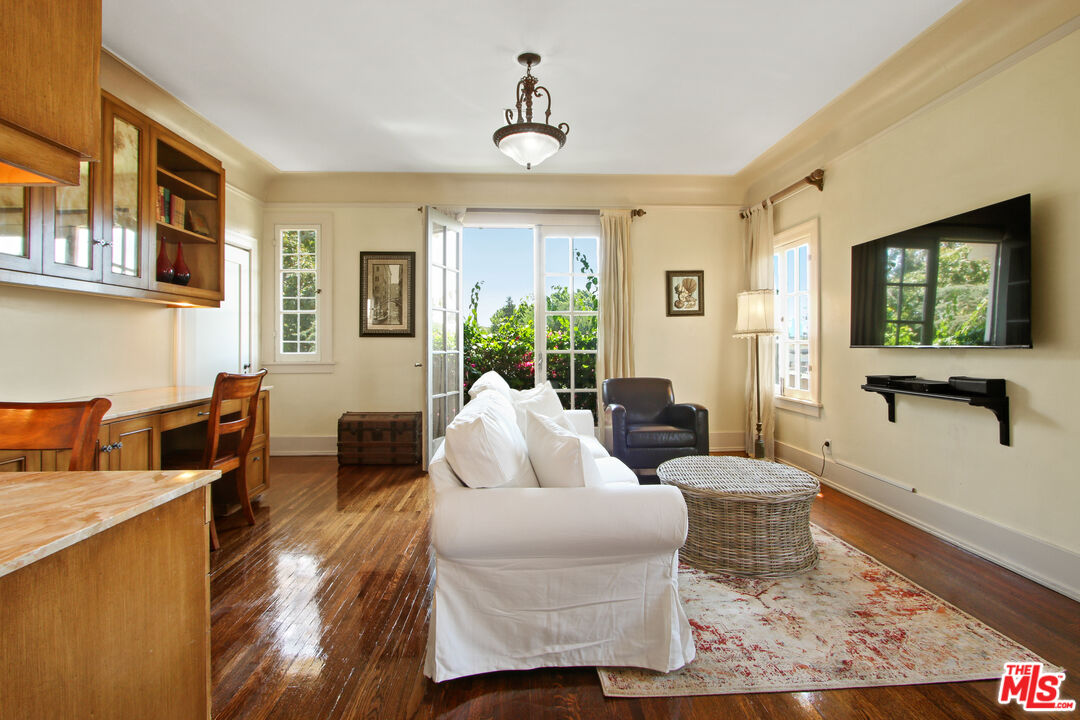 617 North Plymouth Boulevard, Unit 617 1/2 Los Angeles, CA 90004 - Photo 7 of 20 a living room with fireplace furniture and a window