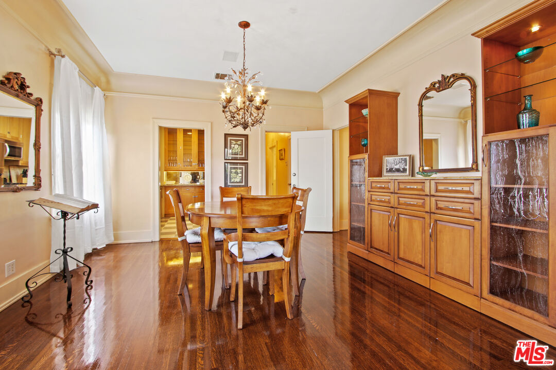 617 North Plymouth Boulevard, Unit 617 1/2 Los Angeles, CA 90004 - Photo 9 of 20 a view of a dining room with furniture and wooden floor
