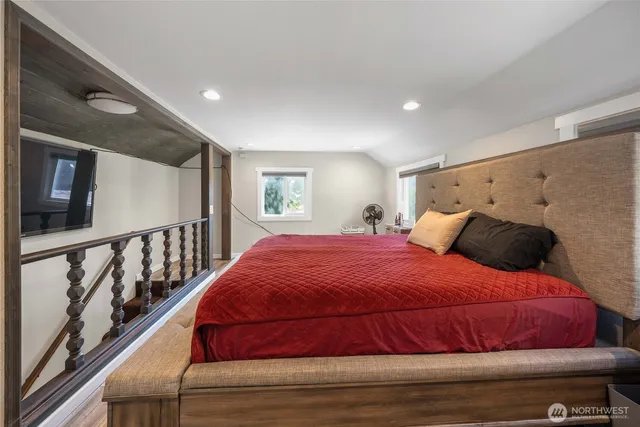 a bedroom with a bed and window