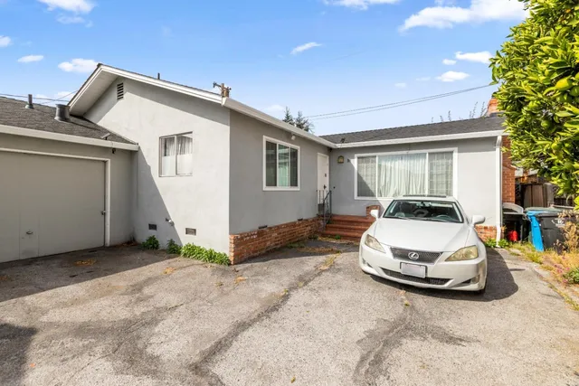 a view of a dining room with furniture and window