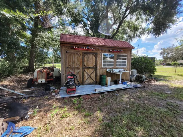 a view of a wooden deck with a yard