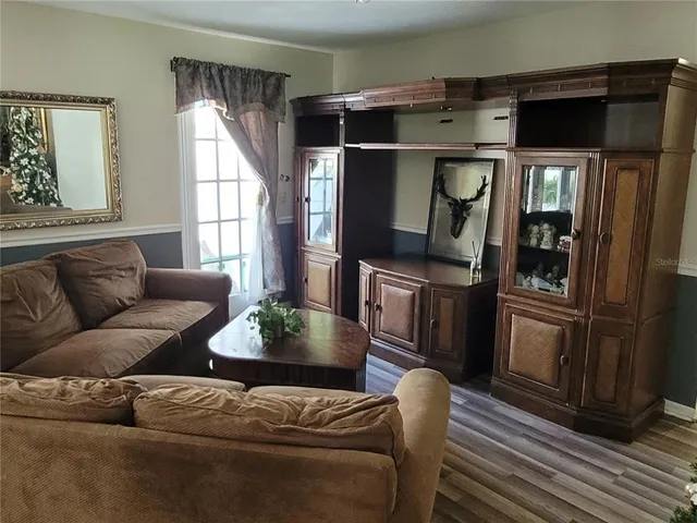 a living room with a couch and a window