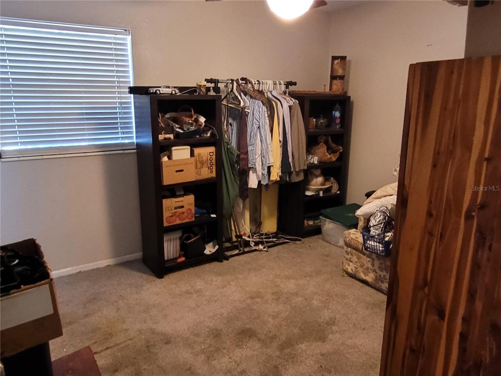 801 9th Street Northeast Fort Meade, FL 33841 - Photo 10 of 14 a view of walk in closet with clothes and shoes