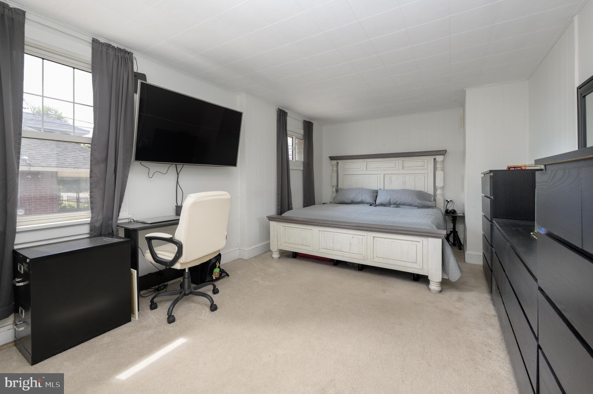 261 South Fellowship Road Maple Shade, NJ 08052 - Photo 13 of 30 a bedroom with a bed and a flat screen tv