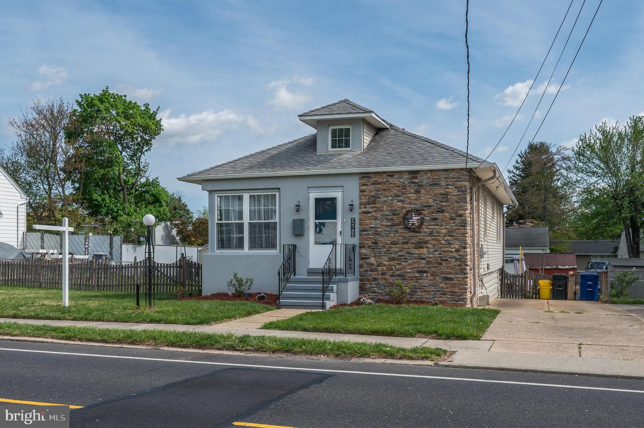 261 South Fellowship Road Maple Shade, NJ 08052 - Photo 2 of 30 a front view of a house with a garden