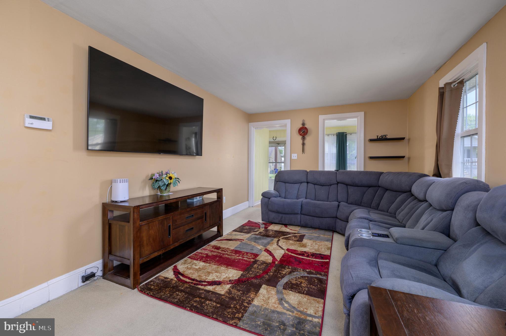 261 South Fellowship Road Maple Shade, NJ 08052 - Photo 7 of 30 a living room with furniture and a flat screen tv