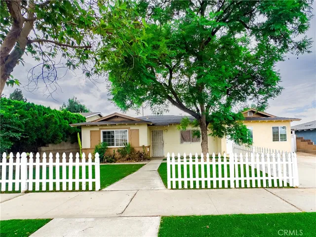 a front view of a house with a small yard