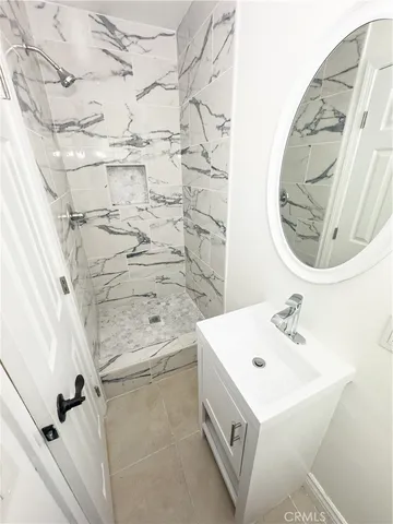 a bathroom with a sink a vanity and a mirror