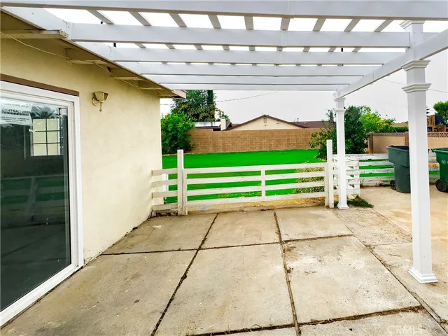 a backyard with a garden and seating space