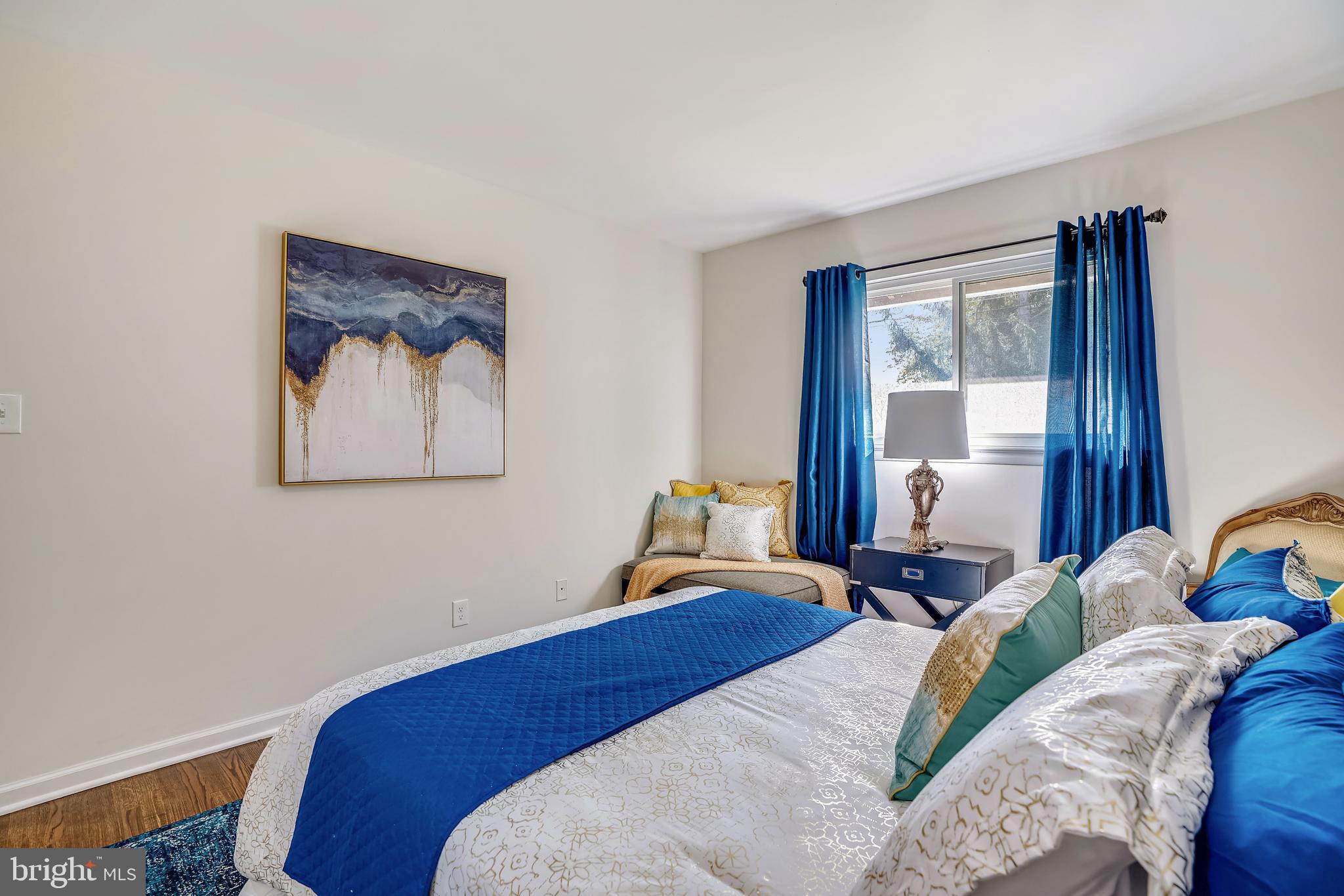 8233 Scotts Level Road Baltimore, MD 21208 - Photo 22 of 37 a bedroom with bed and a window