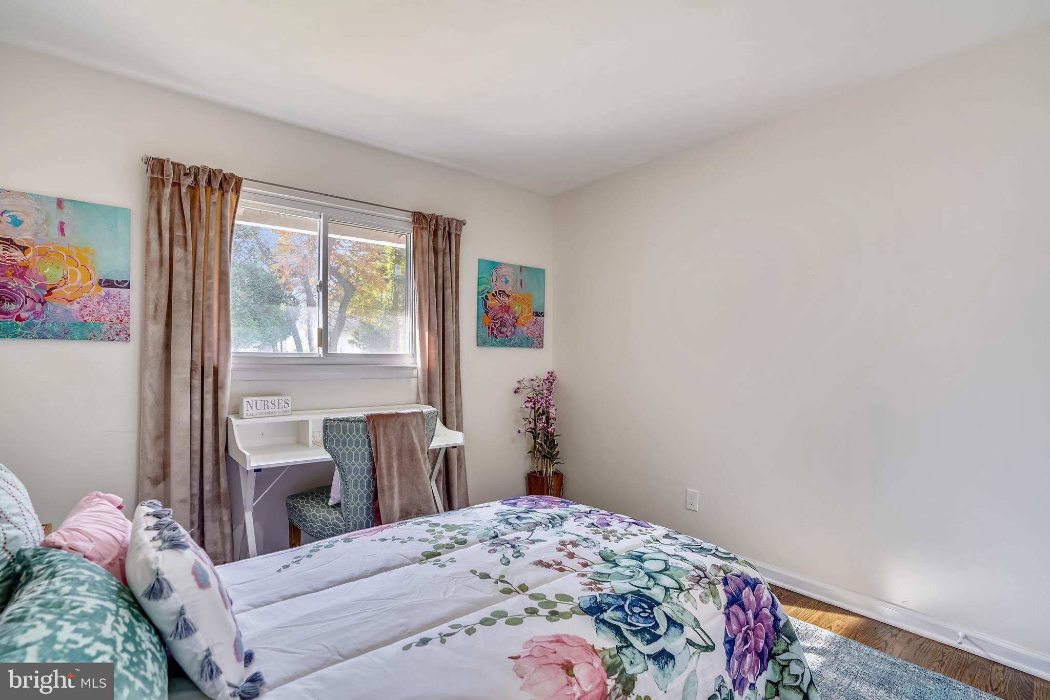 8233 Scotts Level Road Baltimore, MD 21208 - Photo 26 of 37 a bedroom with a bed and a window