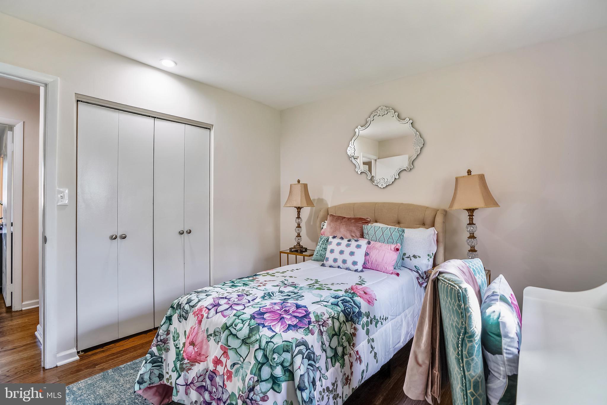 8233 Scotts Level Road Baltimore, MD 21208 - Photo 27 of 37 a bedroom with a bed and a mirror