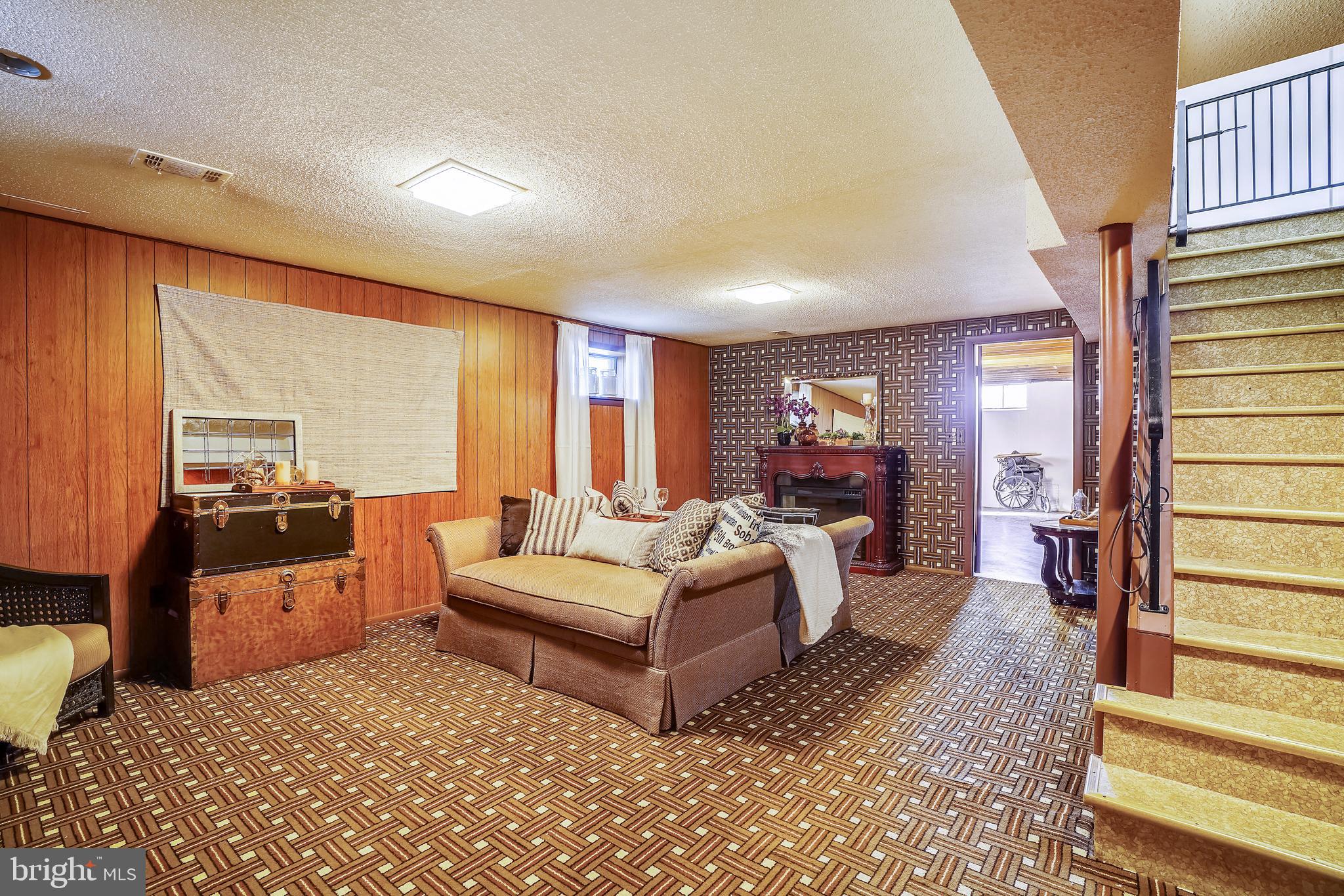 8233 Scotts Level Road Baltimore, MD 21208 - Photo 30 of 37 a living room with furniture and a large window