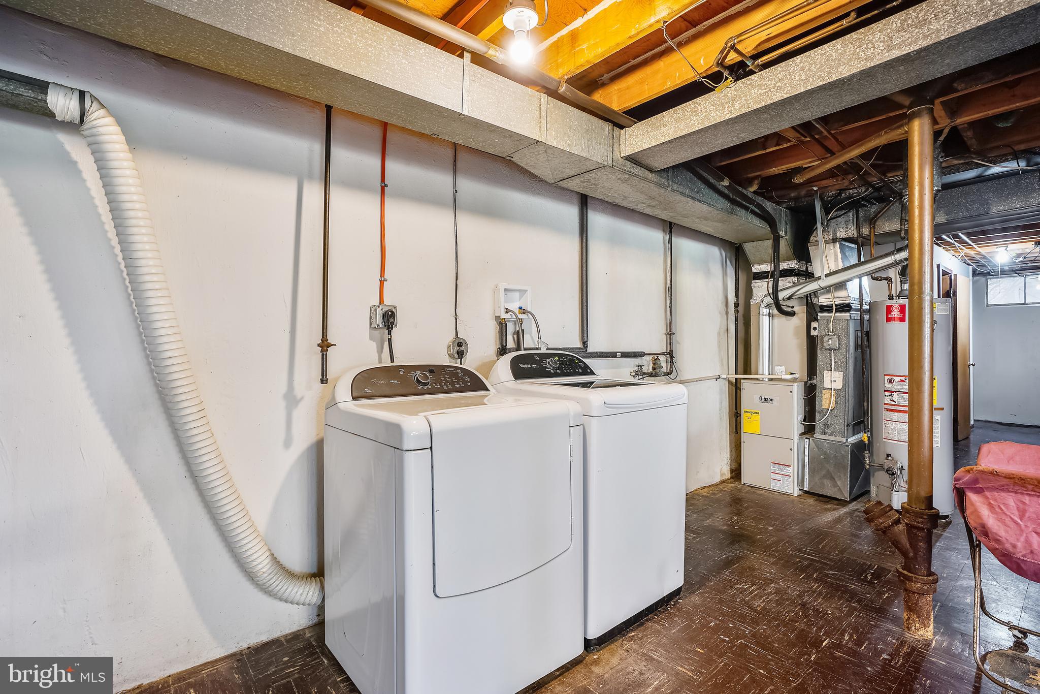 8233 Scotts Level Road Baltimore, MD 21208 - Photo 33 of 37 a utility room with dryer and washer