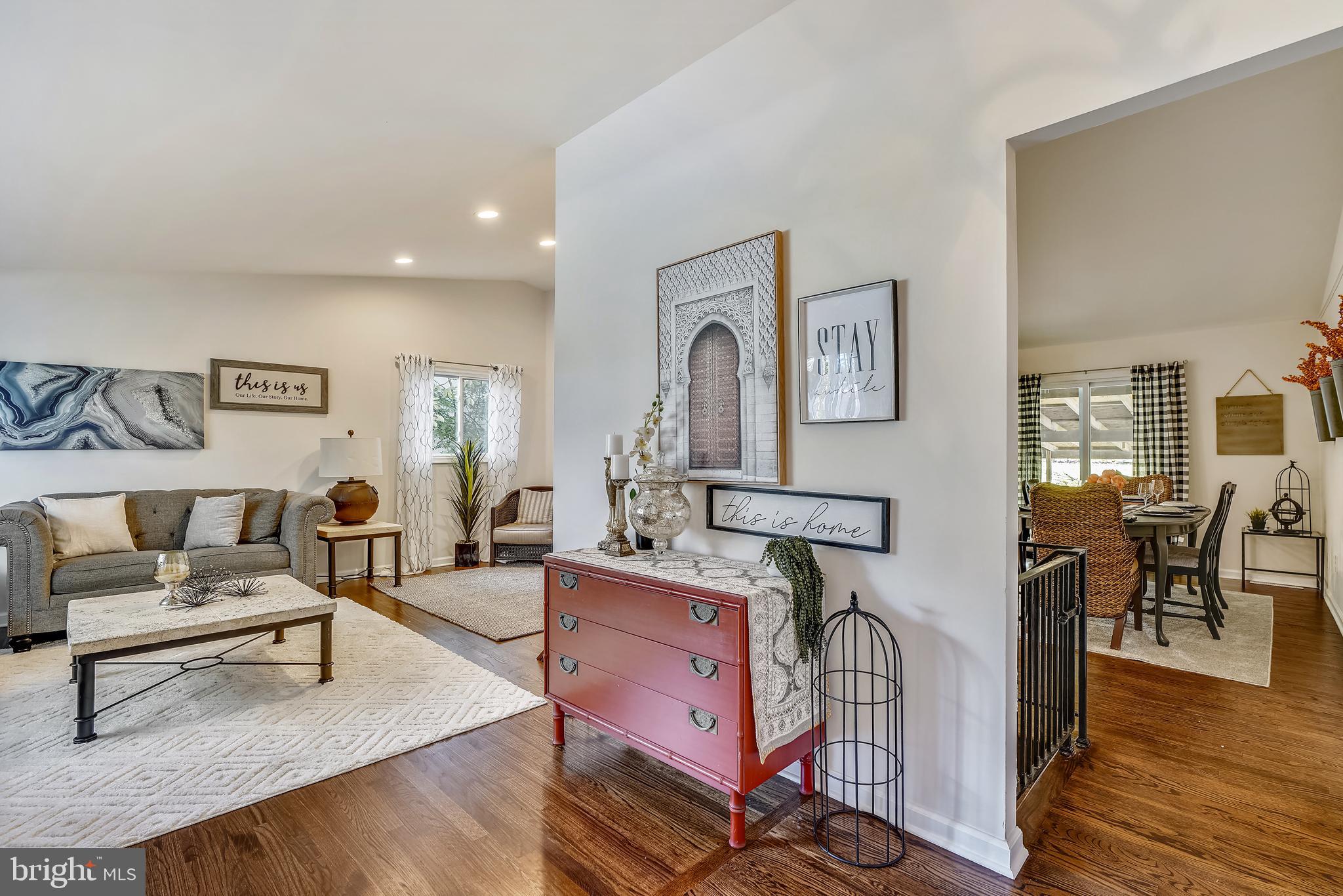 8233 Scotts Level Road Baltimore, MD 21208 - Photo 5 of 37 a living room with furniture and wooden floor