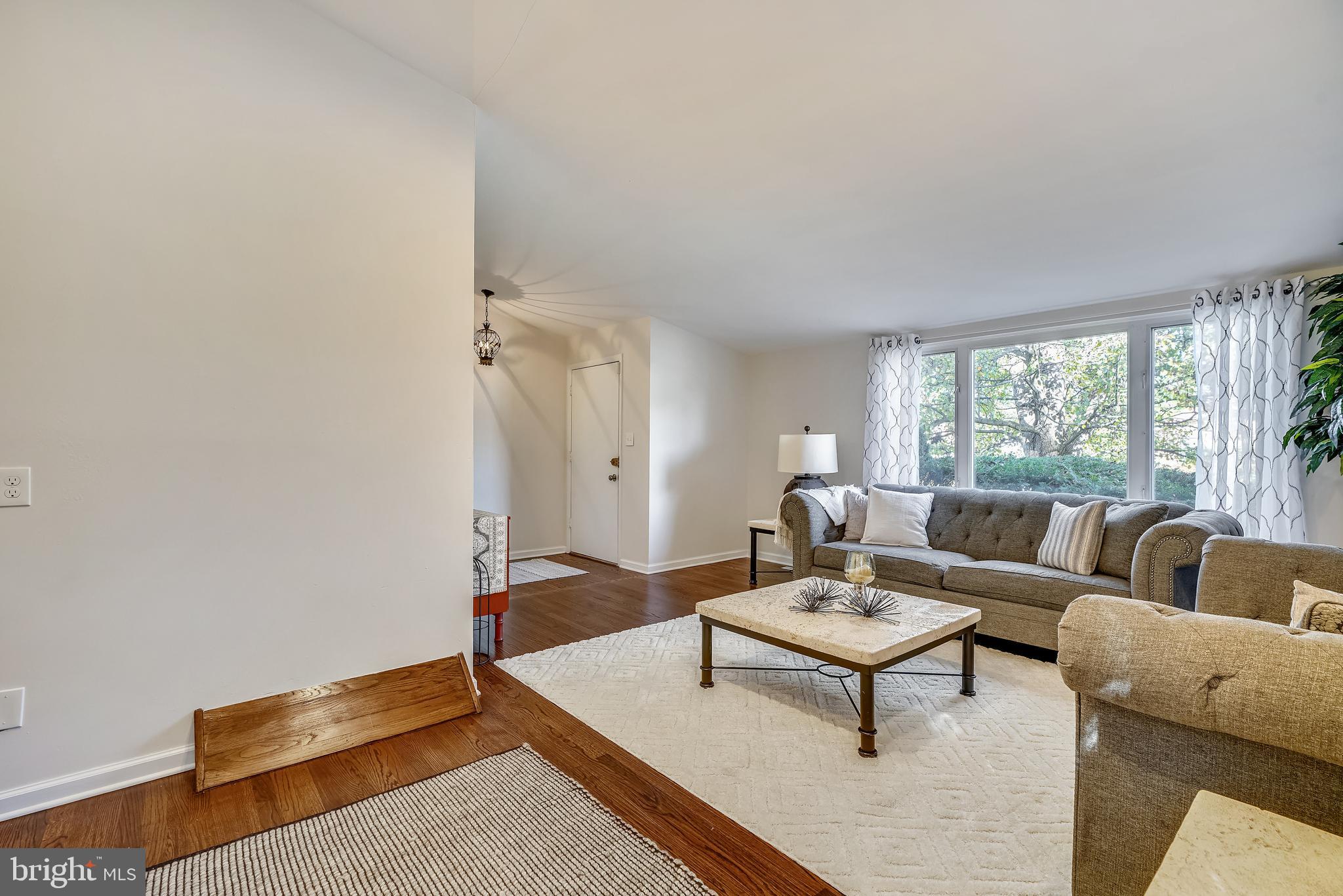 8233 Scotts Level Road Baltimore, MD 21208 - Photo 6 of 37 a living room with furniture and a rug