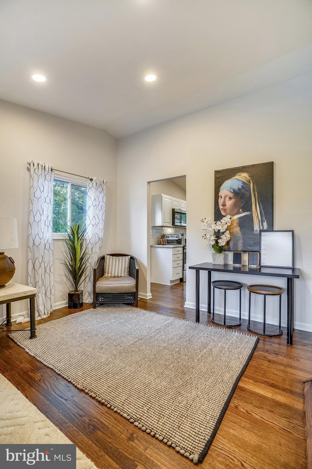 8233 Scotts Level Road Baltimore, MD 21208 - Photo 9 of 37 a living room with furniture and wooden floor