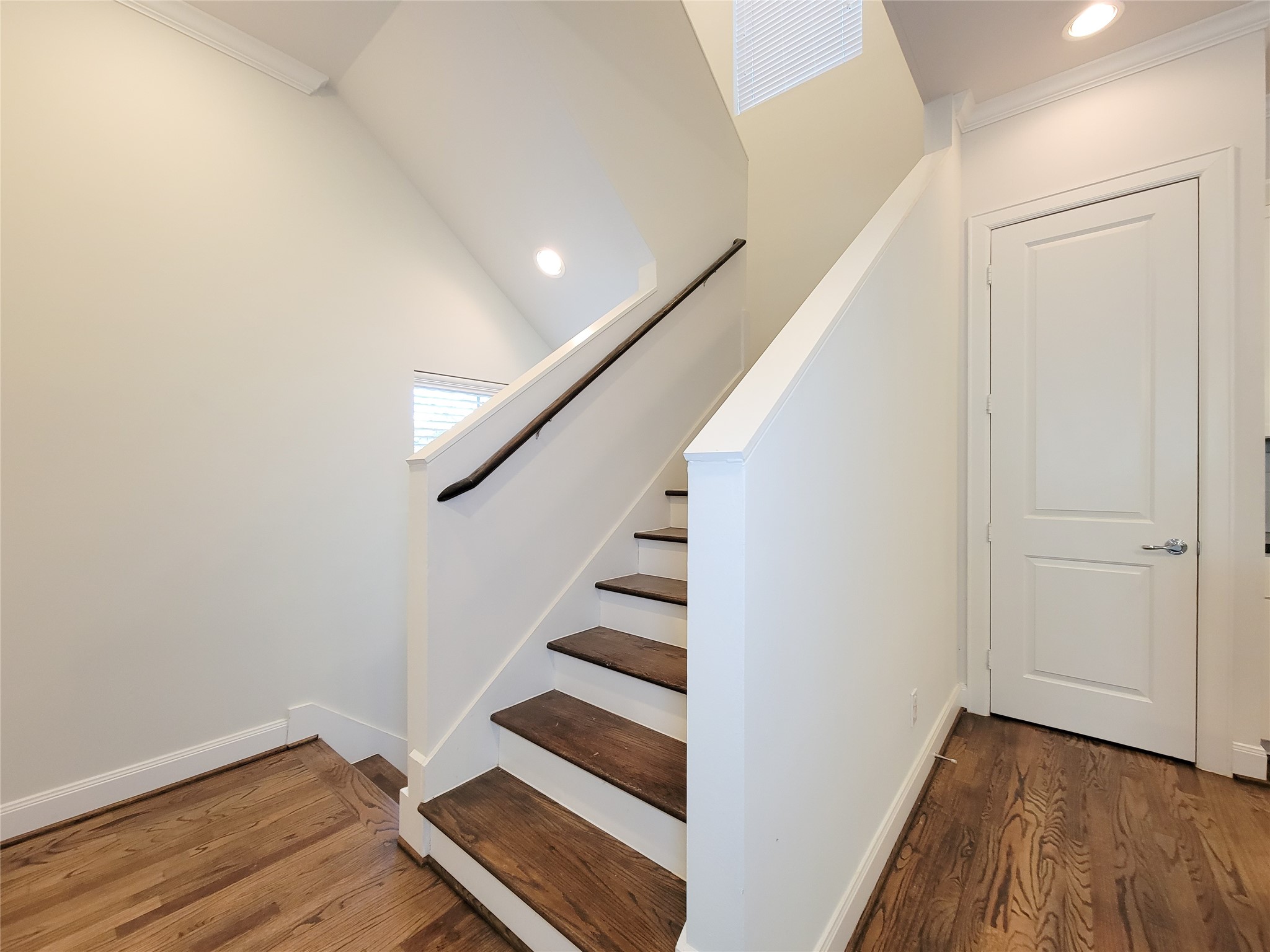 12 Hermann Park Court Houston, TX 77021 - Photo 11 of 43 a view of entryway with stairs and wooden floor