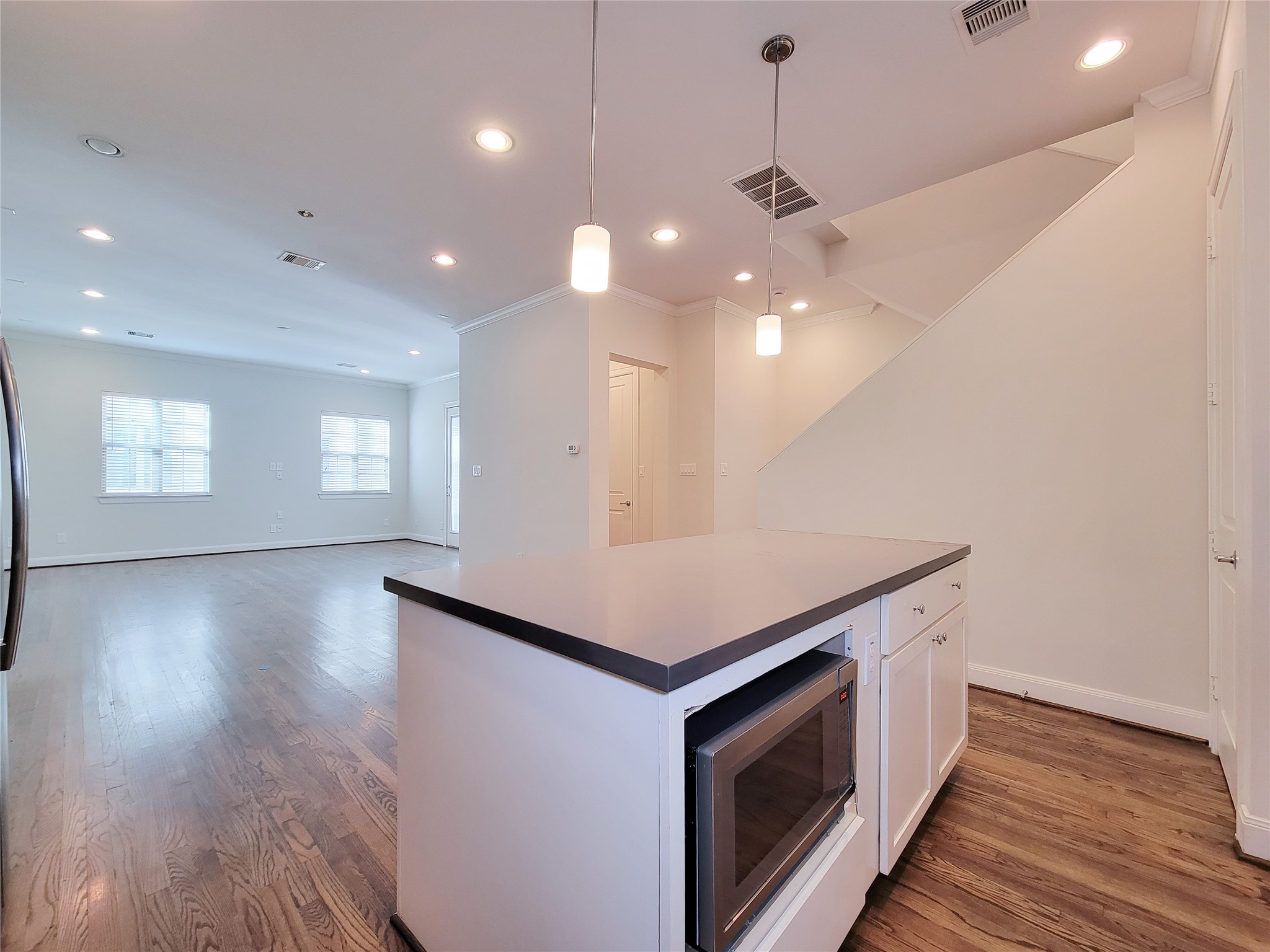 12 Hermann Park Court Houston, TX 77021 - Photo 16 of 43 a kitchen with a stove and a hallway