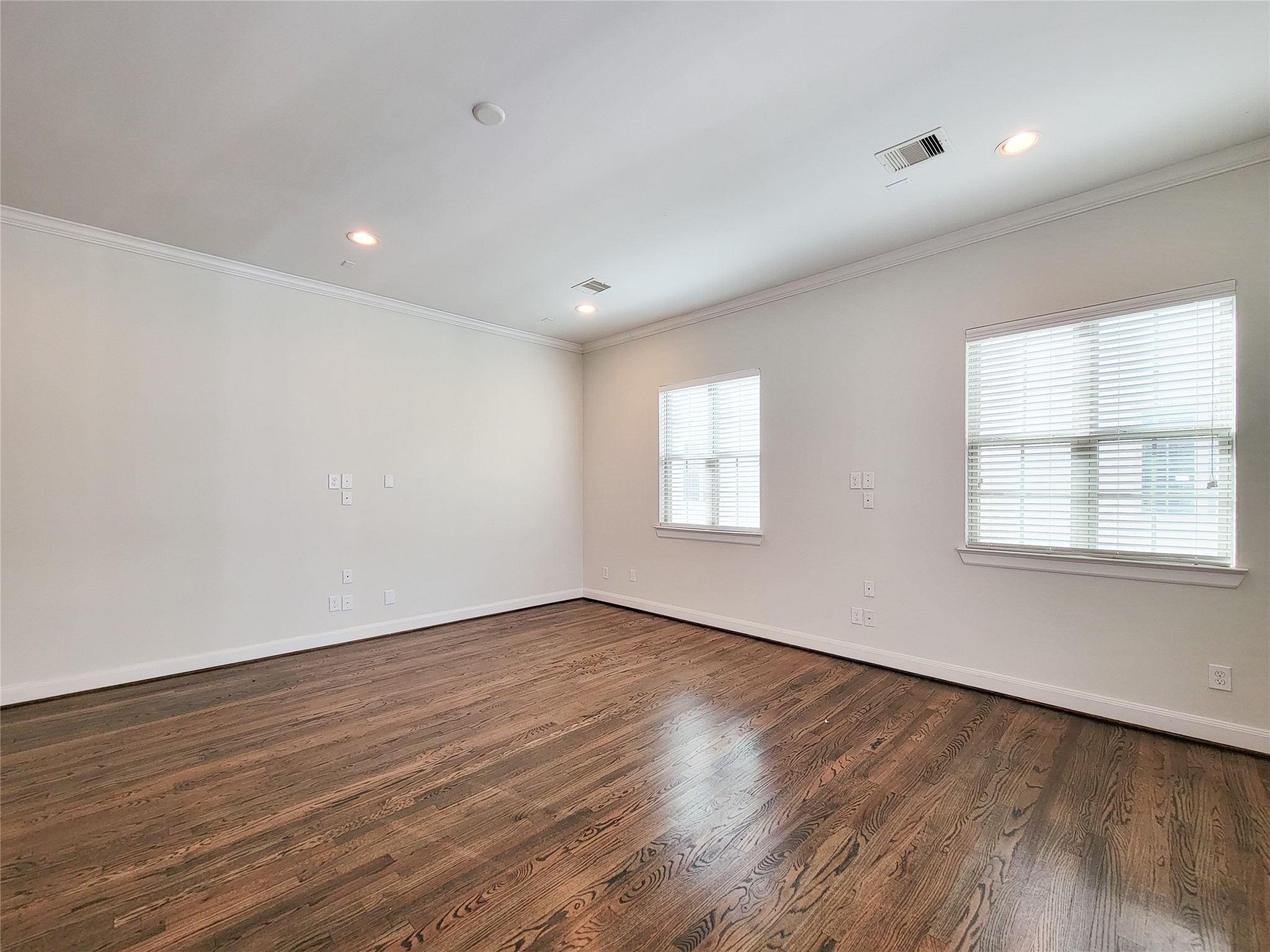 12 Hermann Park Court Houston, TX 77021 - Photo 23 of 43 an empty room with wooden floor and windows