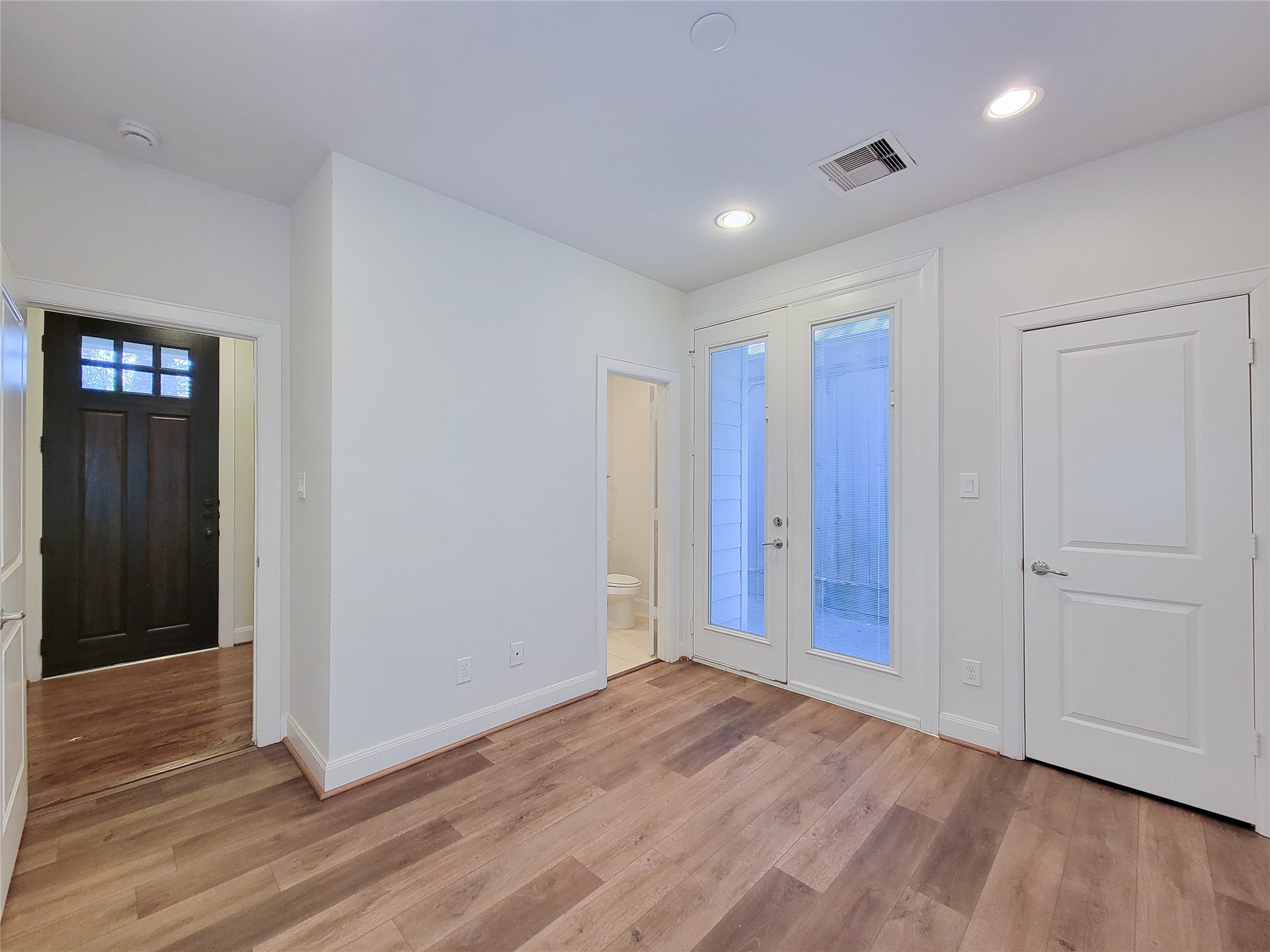12 Hermann Park Court Houston, TX 77021 - Photo 6 of 43 a view of an empty room with wooden floor