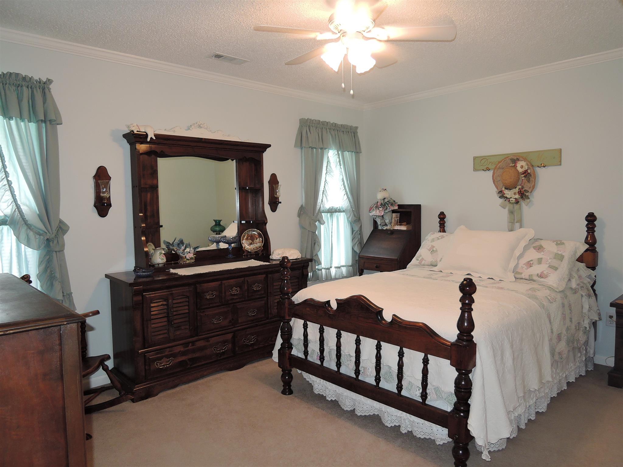 19 Boning Road Fayetteville, TN 37334 - Photo 23 of 30 a bedroom with a bed and a chandelier