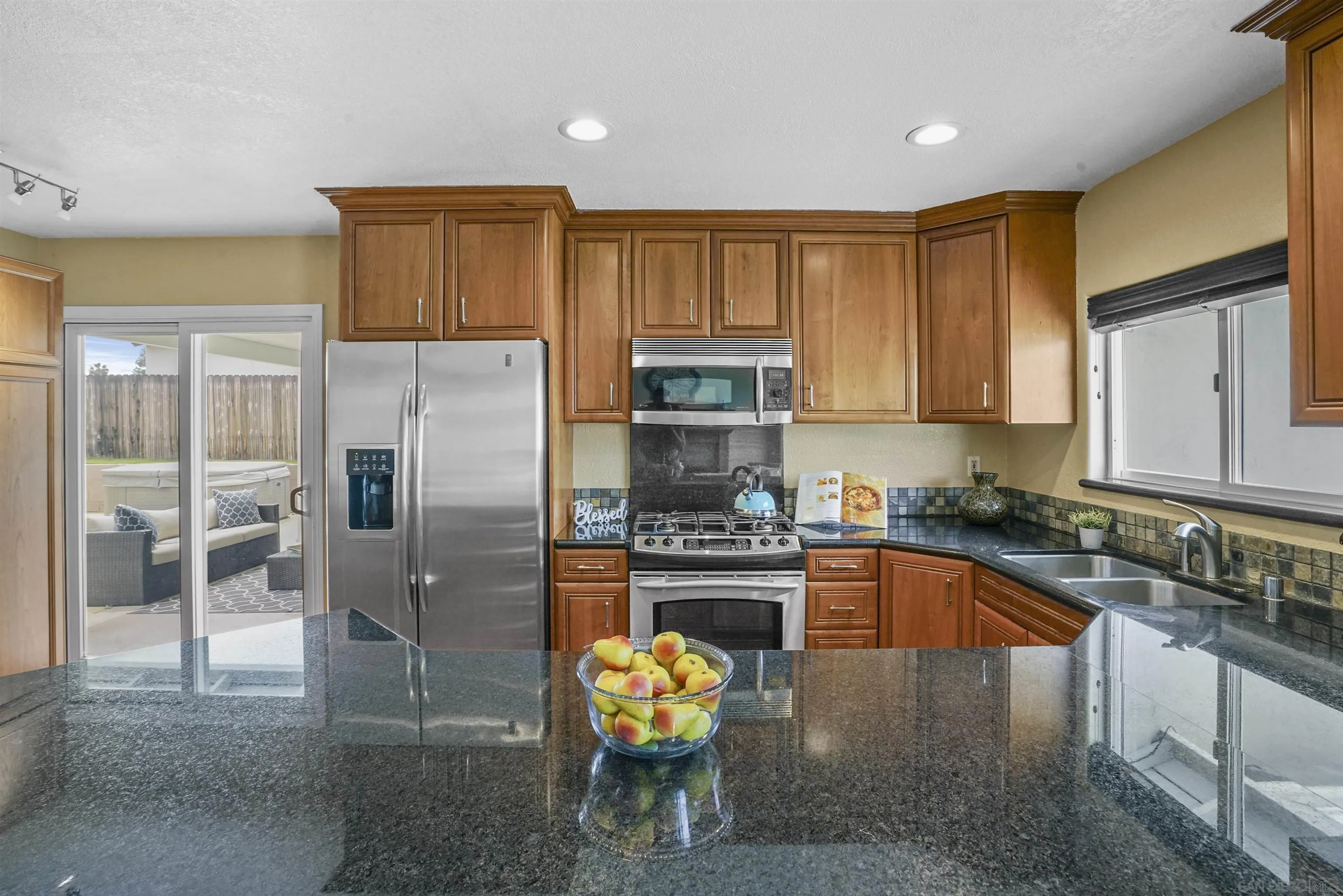 10111 White Pine Lane Santee, CA 92071 - Photo 13 of 35 a kitchen with stainless steel appliances granite countertop a refrigerator and a stove top oven