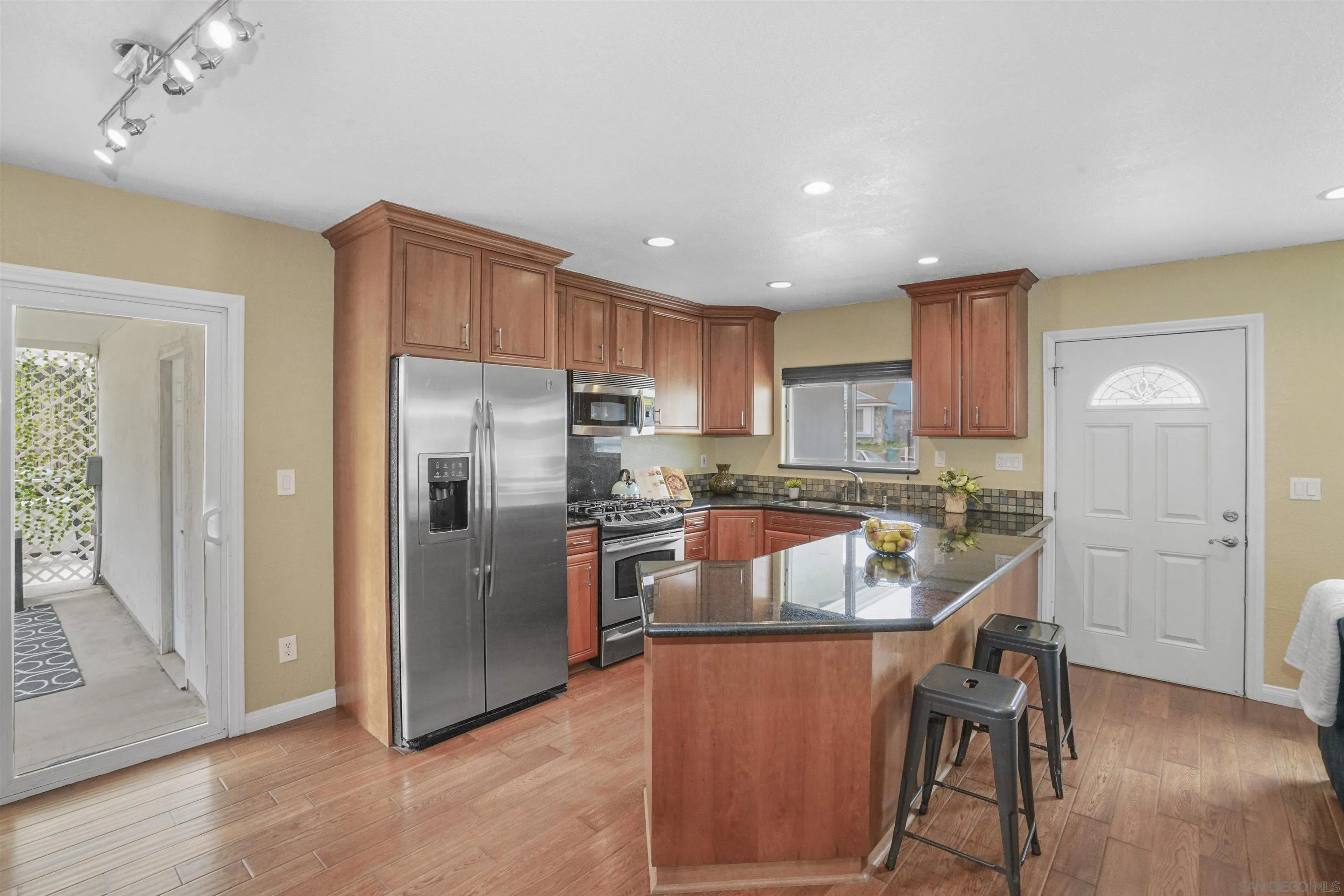 10111 White Pine Lane Santee, CA 92071 - Photo 16 of 35 a kitchen with stainless steel appliances granite countertop a refrigerator a sink a stove and a refrigerator