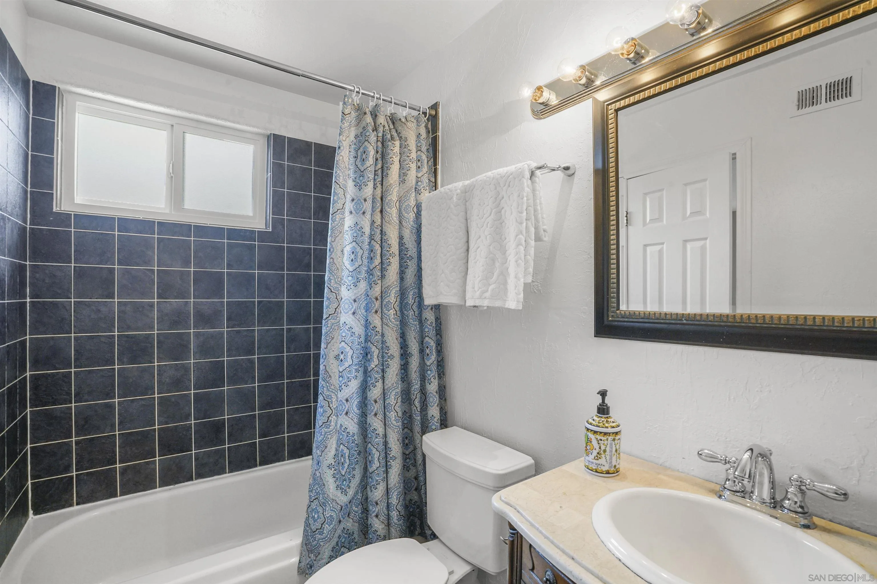 10111 White Pine Lane Santee, CA 92071 - Photo 20 of 35 a bathroom with a sink toilet and shower