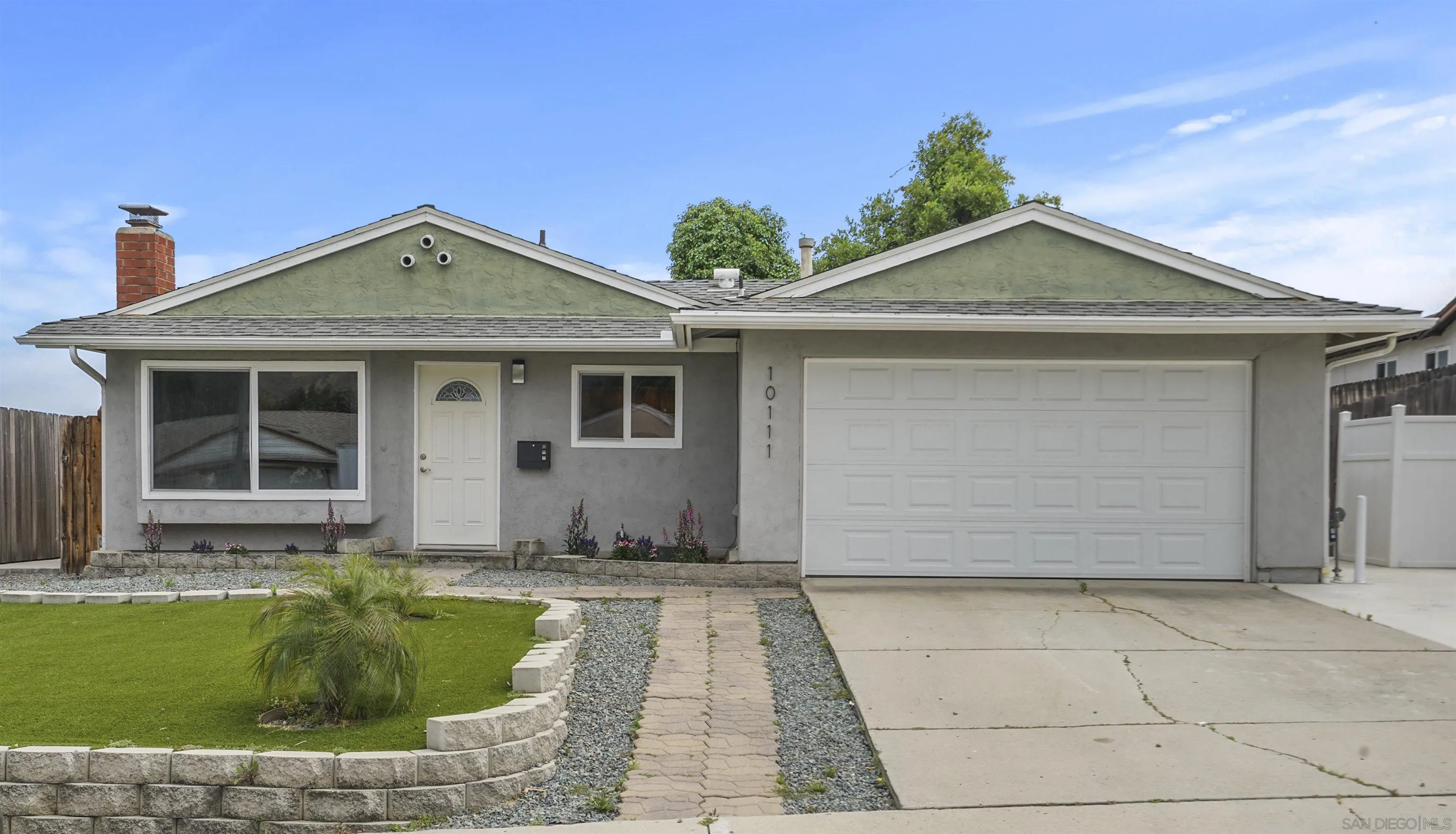 10111 White Pine Lane Santee, CA 92071 - Photo 2 of 35 a front view of a house with a yard