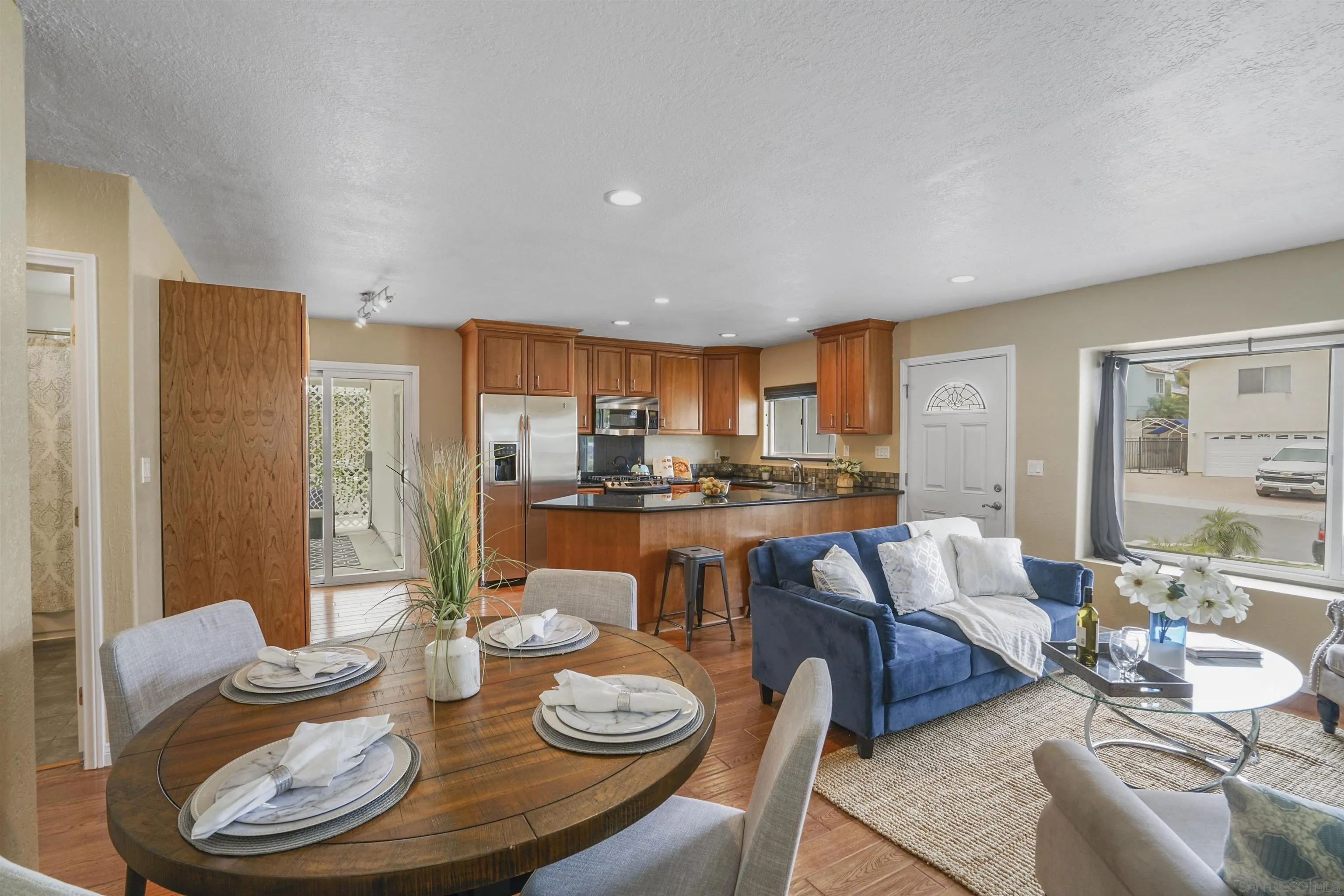 10111 White Pine Lane Santee, CA 92071 - Photo 6 of 35 a dining room with furniture and a kitchen view