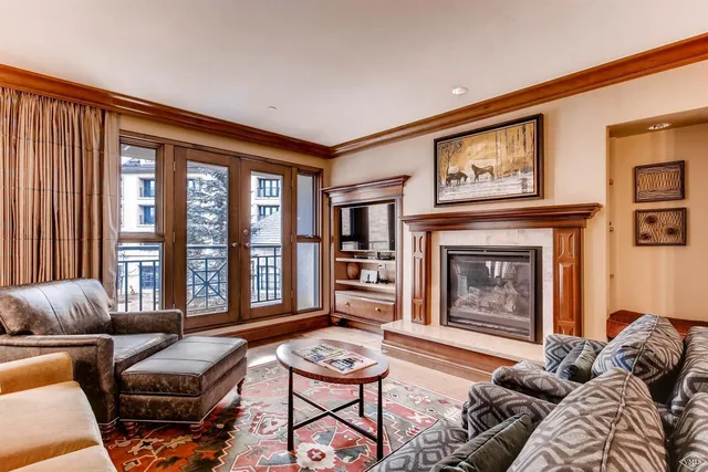 a living room with furniture and a table