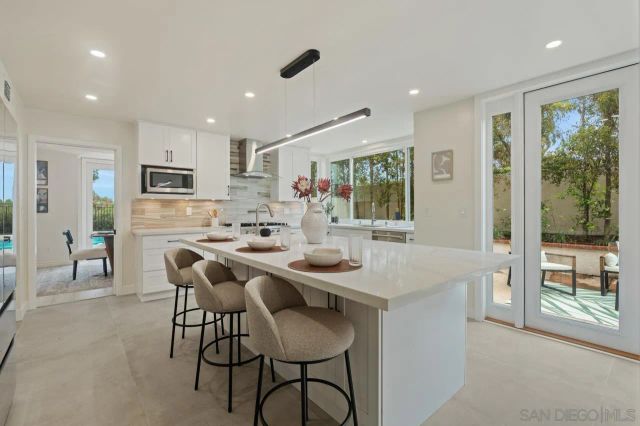 a kitchen with appliances and cabinets