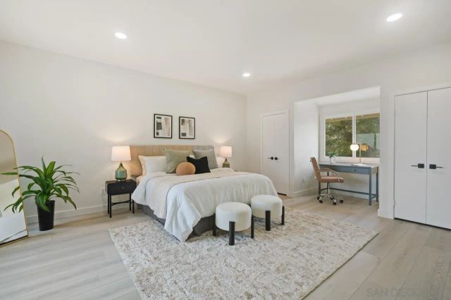 a bed room with a bed and a potted plant