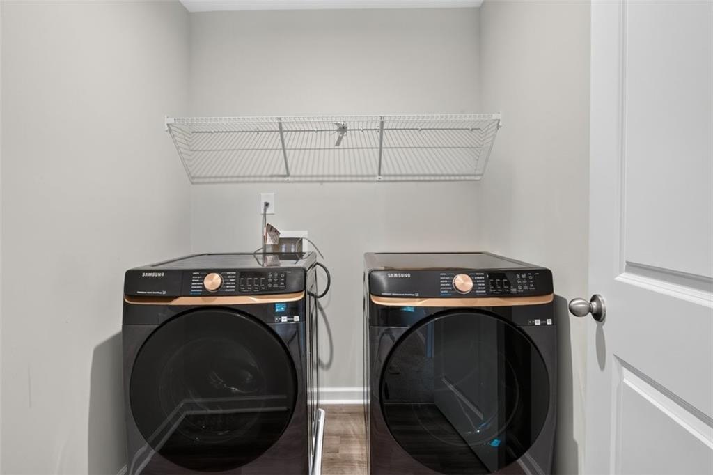 107 Ledgemont Way Acworth, GA 30101 - Photo 44 of 57 a utility room with dryer and washer