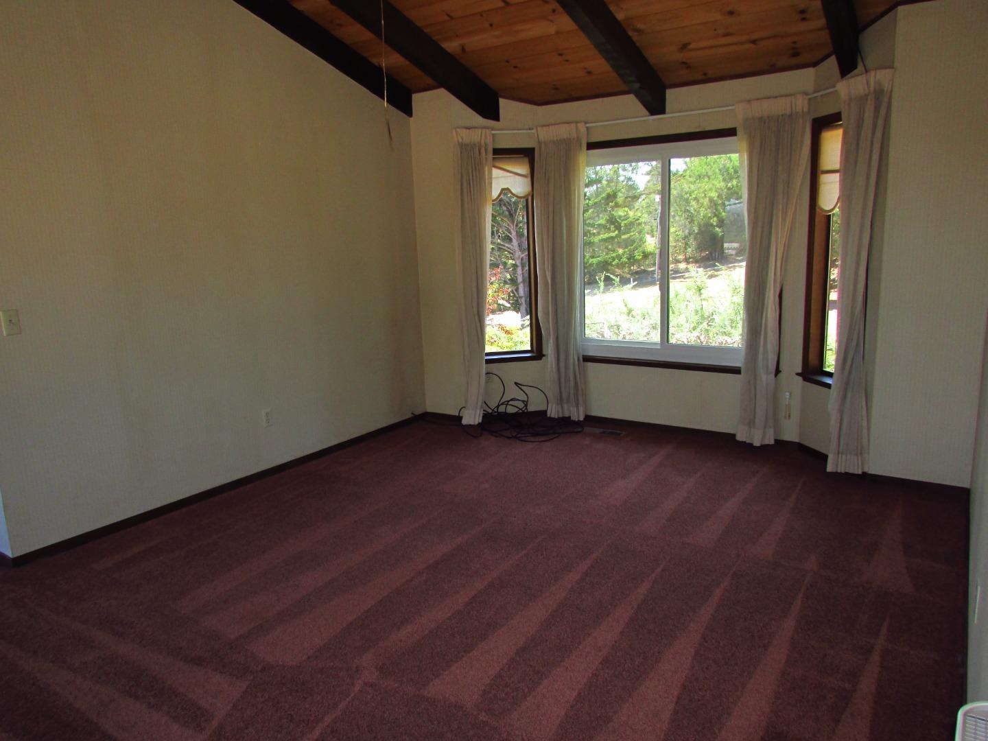 3355 Conant Lane Watsonville, CA 95076 - Photo 15 of 52 an empty room with wooden floor and windows