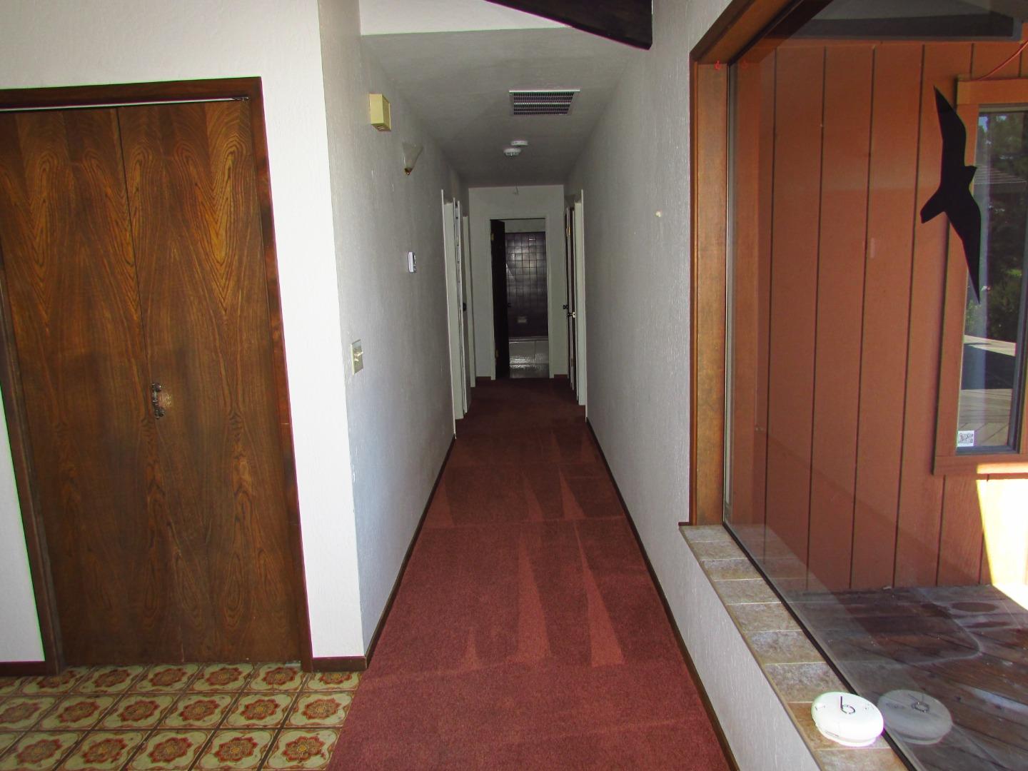 3355 Conant Lane Watsonville, CA 95076 - Photo 16 of 52 a view of a hallway with wooden floor and stairs