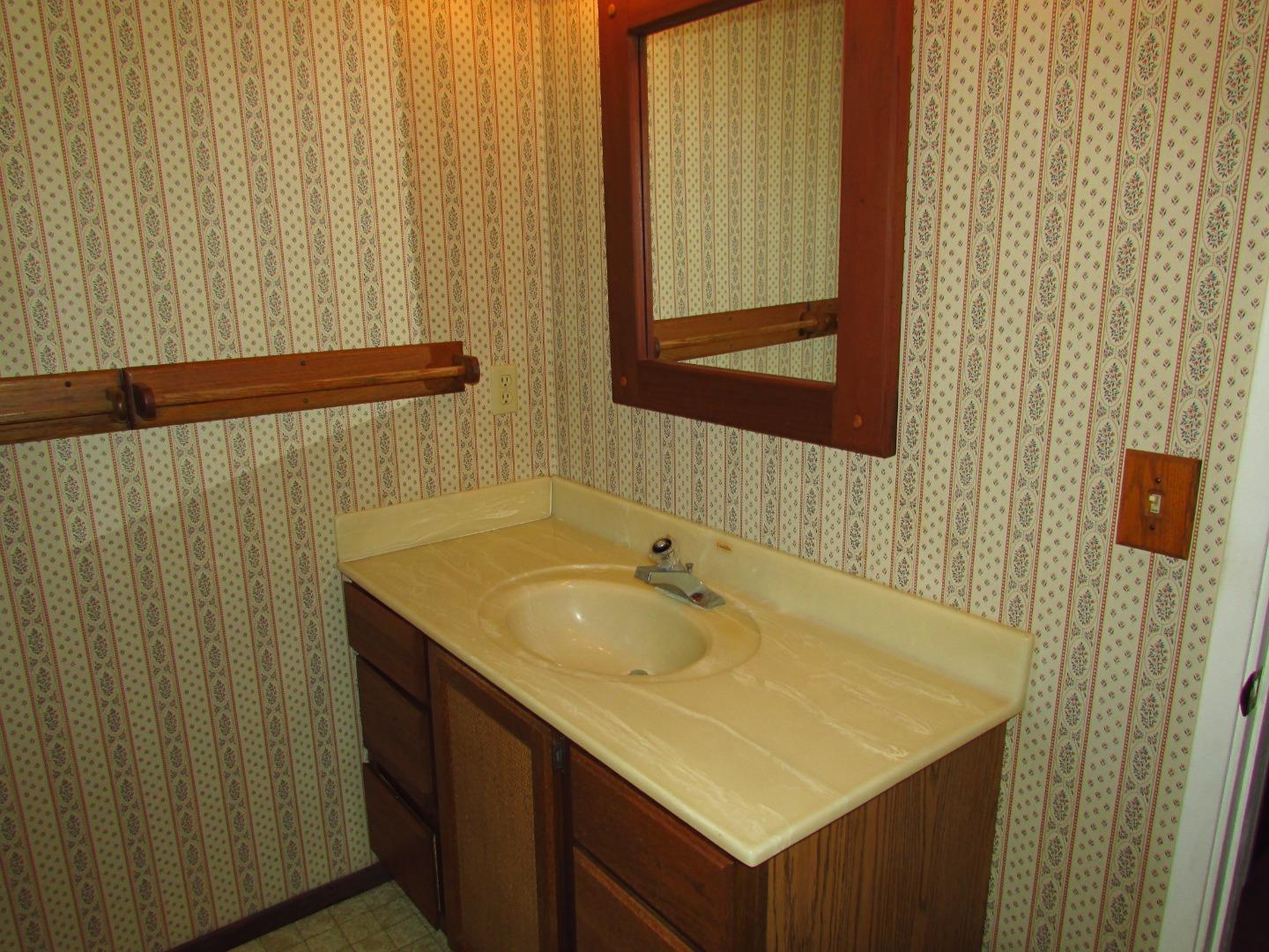 3355 Conant Lane Watsonville, CA 95076 - Photo 29 of 52 a bathroom with a sink and a mirror