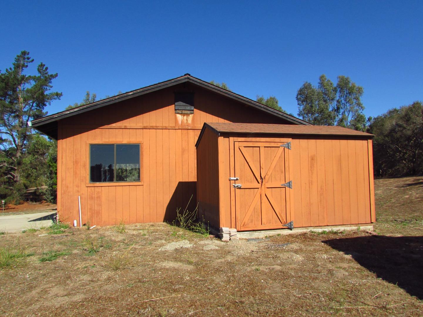 3355 Conant Lane Watsonville, CA 95076 - Photo 32 of 52 a backyard of a house with wooden fence and trees