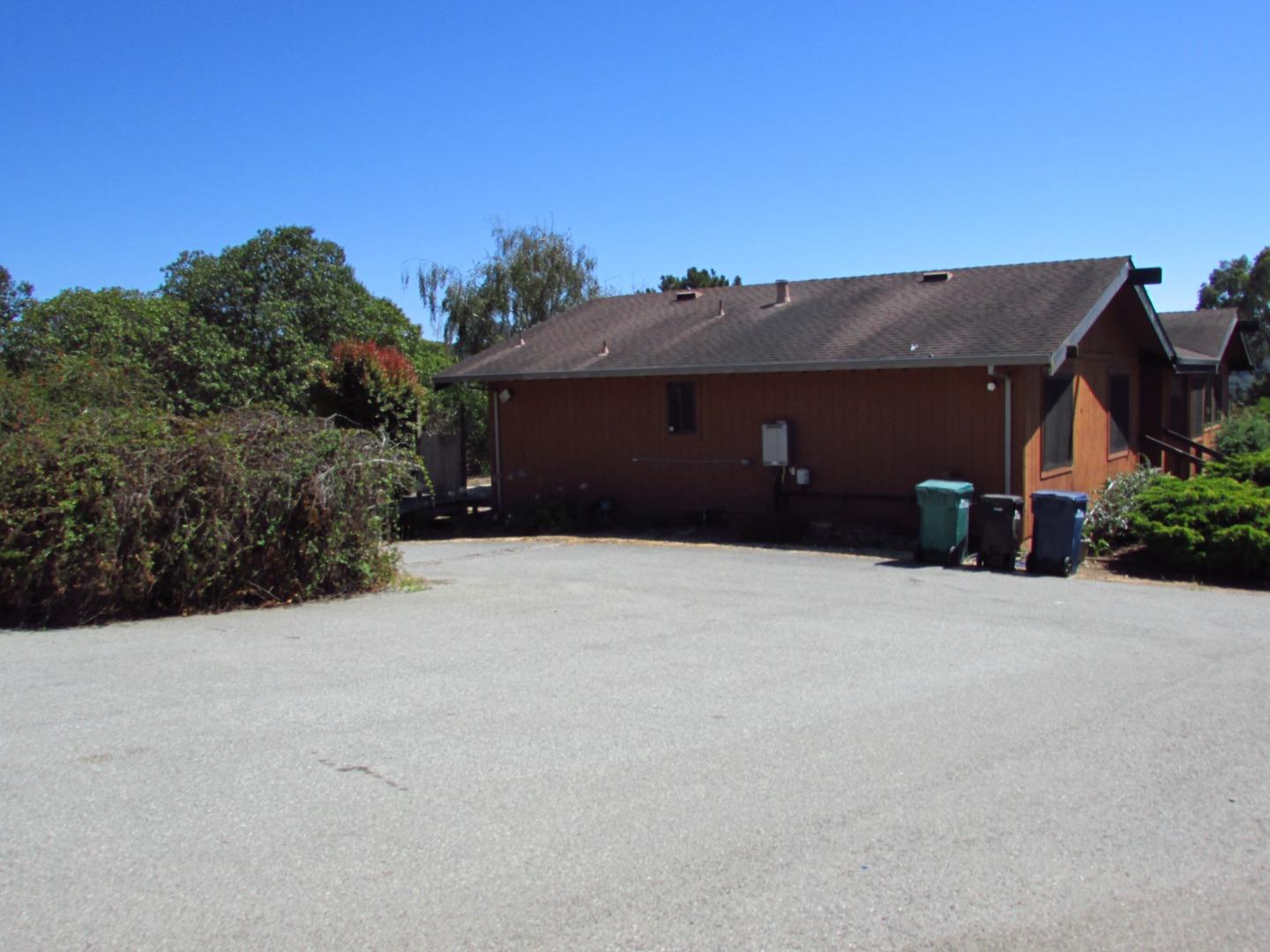 3355 Conant Lane Watsonville, CA 95076 - Photo 42 of 52 a black house with trees in front of it