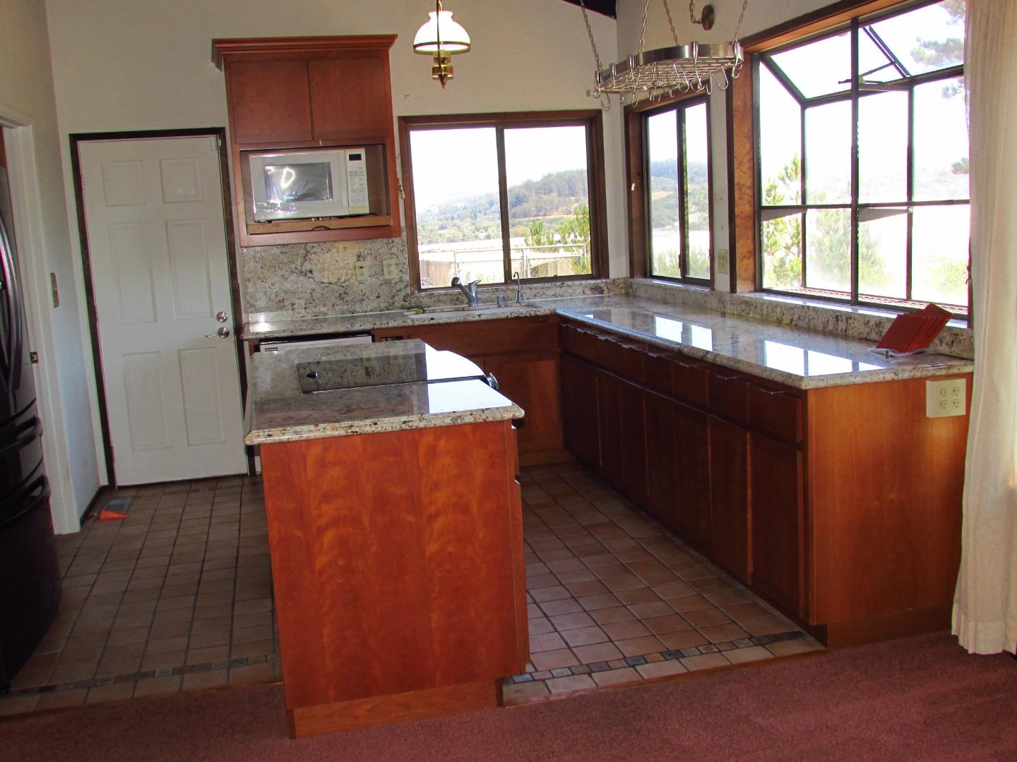 3355 Conant Lane Watsonville, CA 95076 - Photo 6 of 52 a kitchen with stainless steel appliances granite countertop a sink stove and refrigerator
