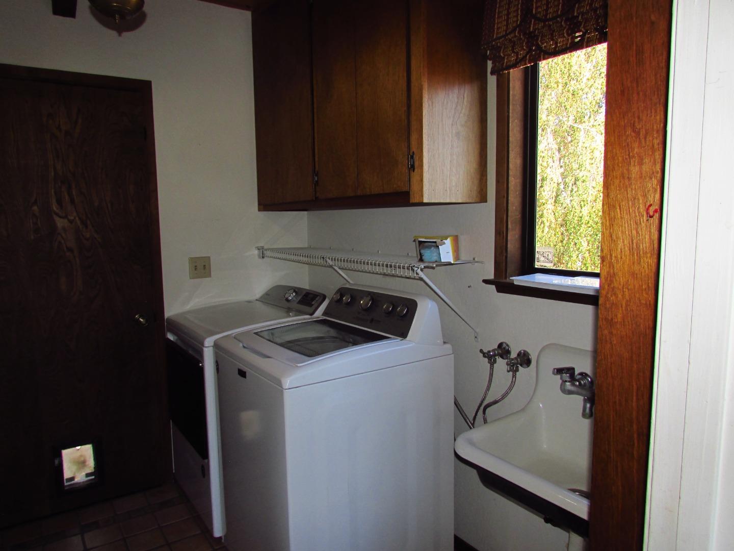 3355 Conant Lane Watsonville, CA 95076 - Photo 8 of 52 a utility room with sink dryer and washer