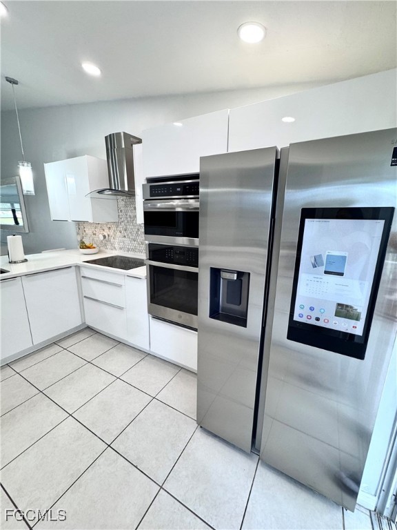 4079 Northlight Drive, Unit 1802 Naples, FL 34112 - Photo 12 of 29 a kitchen with stainless steel appliances a refrigerator sink and microwave