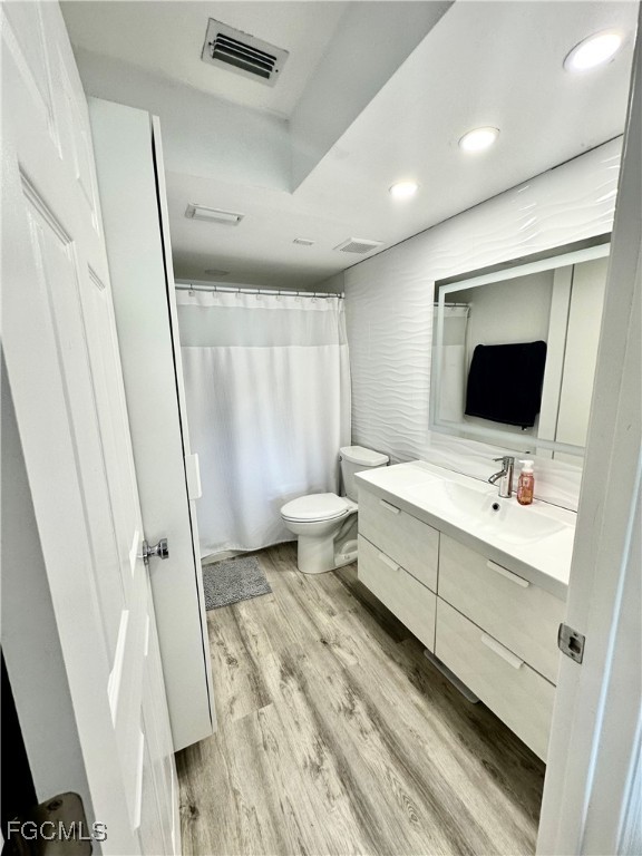 4079 Northlight Drive, Unit 1802 Naples, FL 34112 - Photo 15 of 29 a room with a chair and white walls