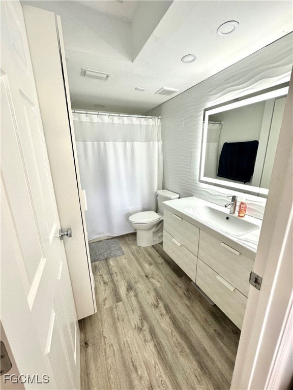 4079 Northlight Drive, Unit 1802 Naples, FL 34112 - Photo 18 of 29 a spacious bathroom with a large mirror and a sink